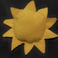 A yellow sun is shown on the black background.